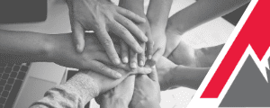 Hands stacked together in teamwork.